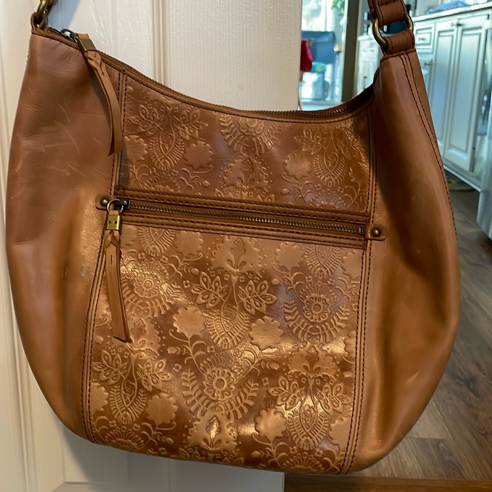 The Sak Tooled Leather Shoulder Bag.  Beautiful details with lots of storage!